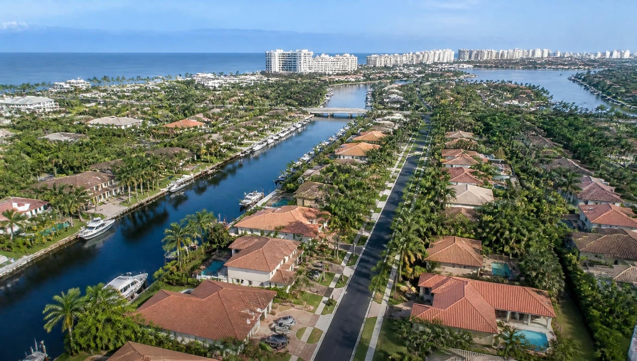 Illustrative example: a residential Broward County street lined with palms and single-story homes.